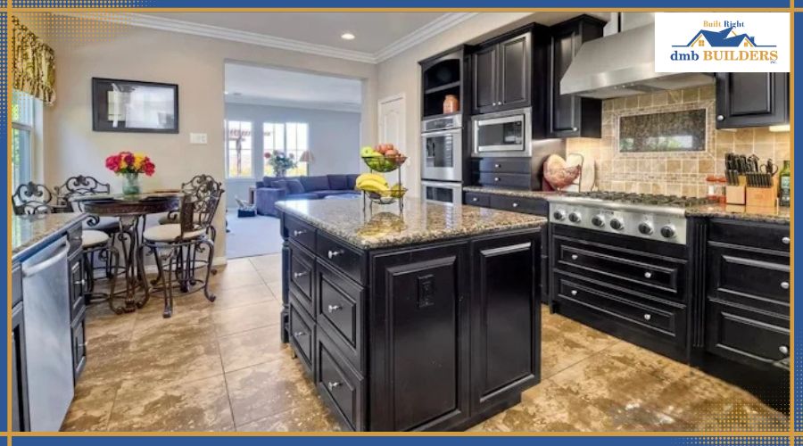 full-home-remodeling-Ranco-La-Costa-CA Modern black-kitchen with granite island, stainless appliances, and a dining area nearby; bright, open-plan layout. By dmb Builders.